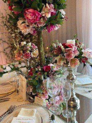Silver Pillar Candlestick with Flowers for hire, centrepieces by Bows Hire, photo 2