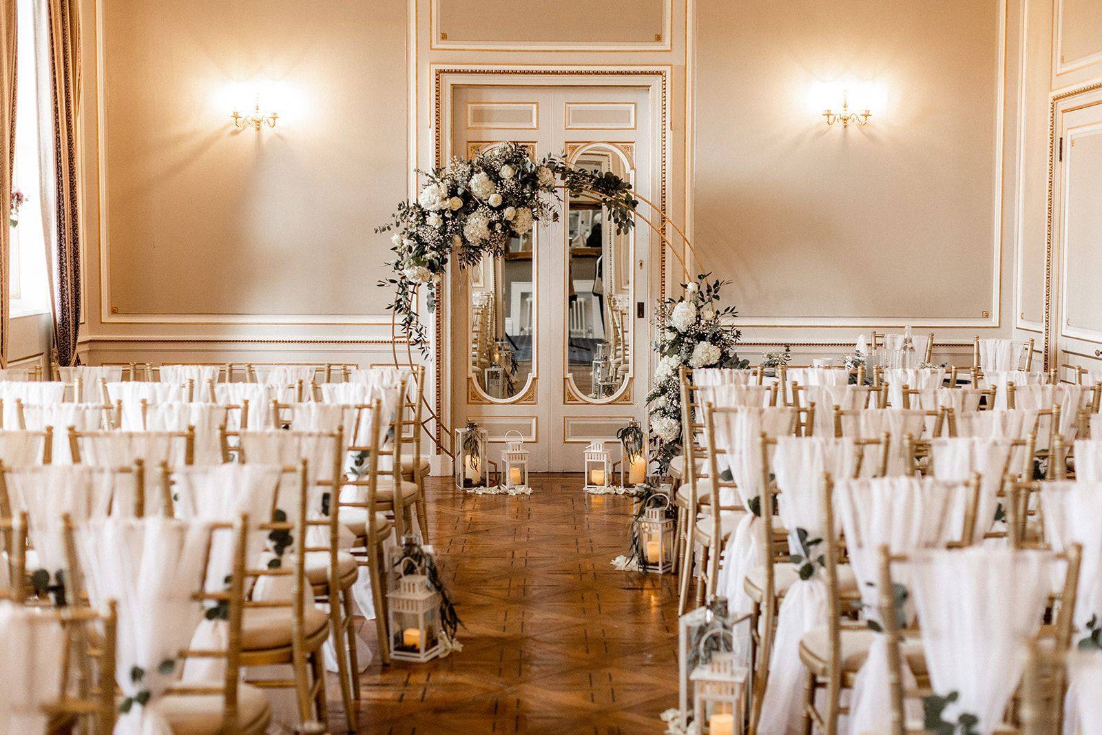 Wedding drapery and lighting in the drawing room at Salomons Estate, styled by Bows Hire